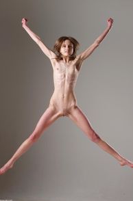 Waif Model Jumping In The Air Naked